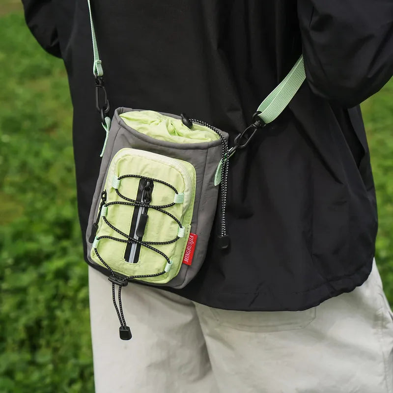 Nixie Outdoor Crossbody Bag – Water Bottle & Phone Holder Crossbody Bag Nixie
