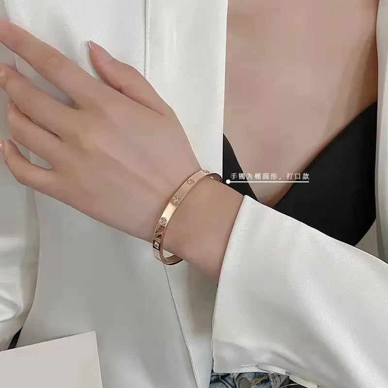 Rose Gold Stainless Steel Bangle Bracelet | Oval Crystal Accents