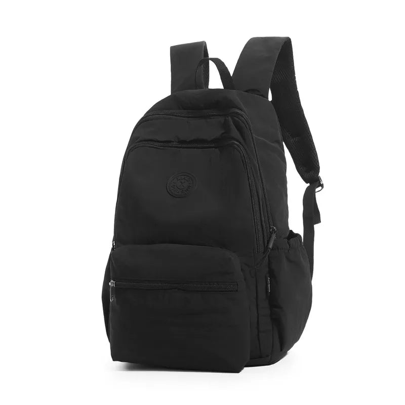 Nixie Lightweight Waterproof Travel Backpack – Unisex 20–35L